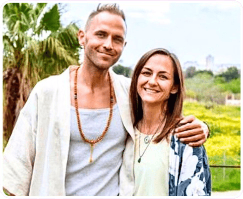 A man and a woman stand outdoors, smiling at the camera. The man has his arm around the woman. Surrounded by greenery and trees, they radiate the joy of healthy living and the promise to live longer together.